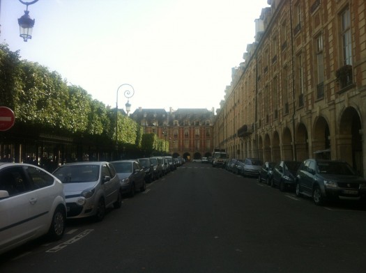 Western edge of Place des Vosges in afternoon light.