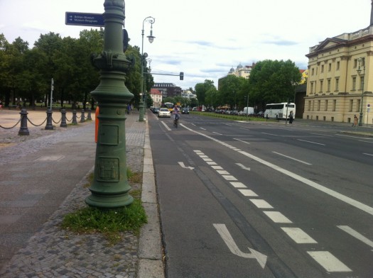 On larger streets that were in need of a street diet, instead of the red lanes there are an intricate series of turn lanes that reduce the design speed for cars.