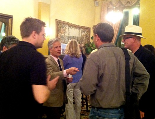 Clay Chapman (with back turned) and Steve Mouzon (in hat) talk with CNU co-founder Andrés Duany in the lobby of the Peery Hotel.