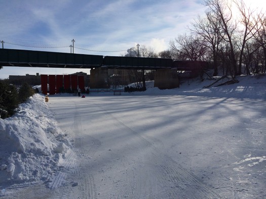 No ice is wasted, as the Assiniboine River is groomed for a hockey rink.