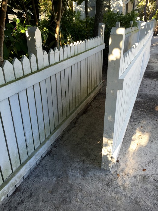 The sliver of space between the two fences. No need trying to squeeze all your beach stuff through because the beaches at the end of each street are private.