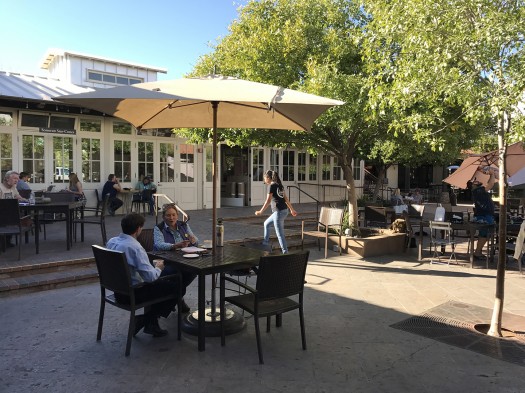 The marketplace gathers around a central courtyard, resplendent with shade.