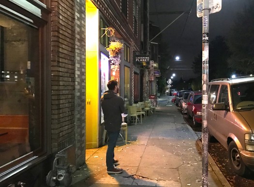 The buffer of on-street parking makes walking feel less dangerous, while enjoying the gifts to the street of outdoor café seating.