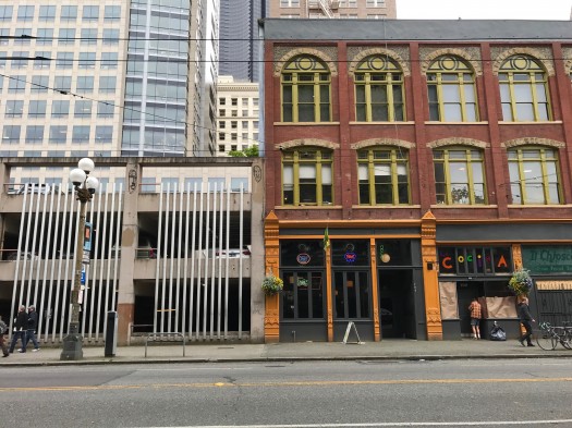 There are many reasons to use liner buildings to shield parking garage views on pedestrian streets. This beauty and the beast on Cherry Street and 1st Avenue show a few.