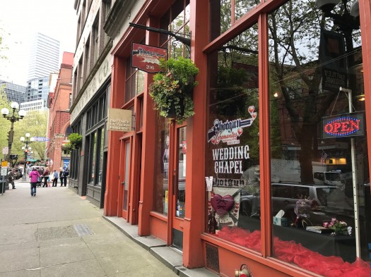 These blade signs and window signs are made for walking speed. And in the case of the wedding chapel, speedy walking. 1st Avenue between Washington and Main.